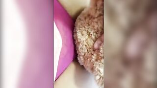 A girl is masturbating with her favorite teddy bear in this hot video