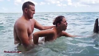 A couple enjoys romantic sex in the blue lagoon