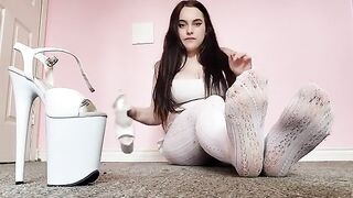 Sexy brunette in white tights indulges in foot play with sensual sole licking