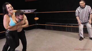 Brunette femdom Nadia White crushes her opponent’s cock in a match