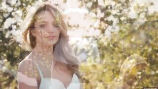 A glamorous woman has a moment of nature in the open air