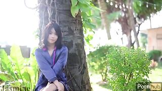 A sunny day in the garden with a passionate Asian beauty