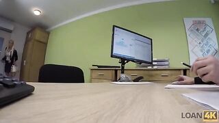 A business lady is trying to get a loan from the bank to develop her business