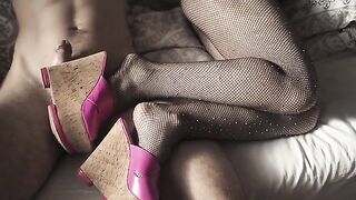 A super cute girl in sexy high heels and pantyhose is waiting for you