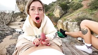 Two pretty girls, 18 y.o., have fun with tourists on the beach