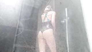 She squirts her wet pussy in the shower, alone