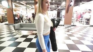 A big ass blonde is fucking in the shopping mall toilet for money