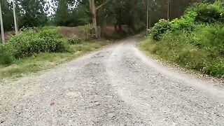 A beautiful woman met a friend while riding her bike