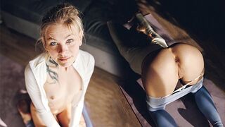 The pretty girl is doing her exercises in very sexy yoga pants