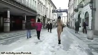 A student is showing her boobs and ass on the city streets