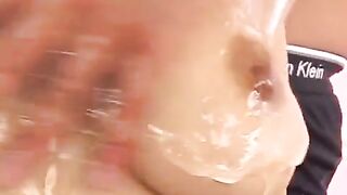 Oiled Japanese boobs handjob with a naughty twist, damn hot!
