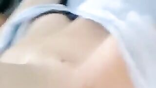 A half-naked beauty tells lies and caresses her body