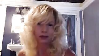 A aged woman caresses herself in the bathroom with pleasure