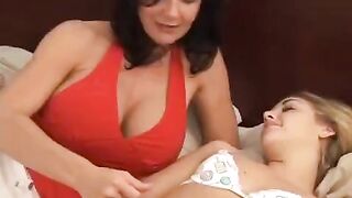 Young lesbian with MILF using a strap-on dildo
