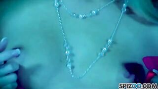 The blonde caresses her pussy with a big dildo