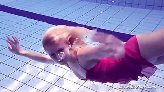 Helen has a swim in the pool without any clothes