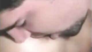 The man has sex with a strapon and another girl