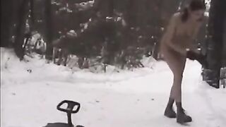 Nude girls are throwing snowballs at each other on the street