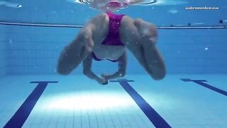 A hot and sexy naked woman swimming in the pool is very nice to look at