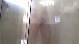 A man washes himself in the shower, but there’s a camera watching
