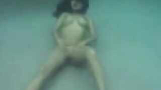 Busty brunette beauty gets fucked underwater in the ocean