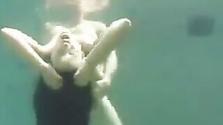 Busty brunette beauty gets fucked underwater in the ocean