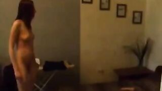 A young Russian beauty caresses herself in the kitchen, feeling great