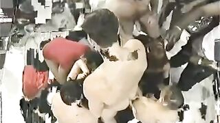 The crowd fucked a girl with big tits in an intense interracial group scene