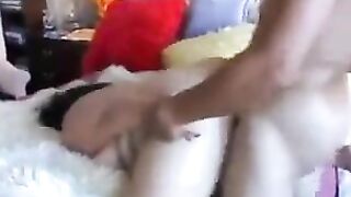 A juicy and fat ass Asian girl is having fun on her bed