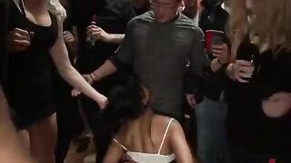A mature woman is being fucked by a group of men