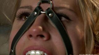 A girl is tied up and she is at the mercy of her master