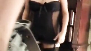 A husband is having fun with his sexy wife in a corset