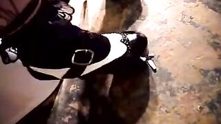 Babe masturbating her sweet pussy in a public toilet bowl