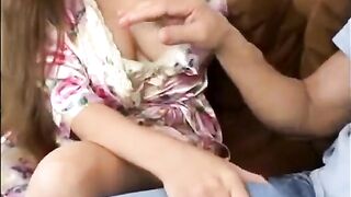 A mother is having fun with her eldest son on the couch