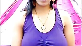 The nipples of an excited brunette stick out through her T-shirt