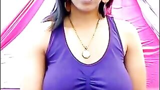 The nipples of an excited brunette stick out through her T-shirt