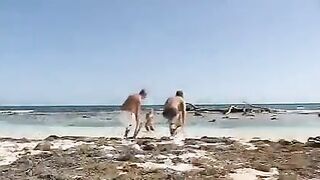 Bikini girls are having fun on the beach with two guys