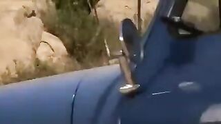 A girl with big boobs is getting fucked right on the car, wow!