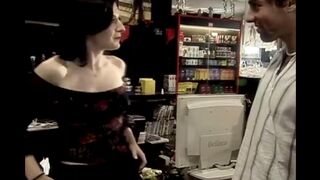 A hot chick is fucking with a customer on the set