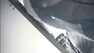 The hidden camera at the checkout captures a skirted chick