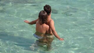 A naughty girl playing with the guy’s cock underwater