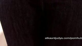 A mature woman masturbates her pussy on the couch