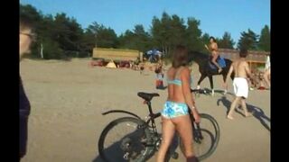 A girl has sex with her boyfriend on the beach