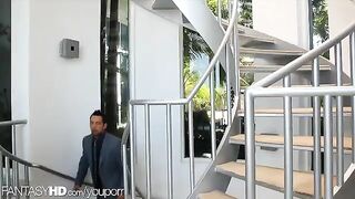 A masseuse has two male clients at her house for a massage
