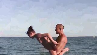 Beach naked gymnastics with a sexy girl, showcasing flexibility and sportiness