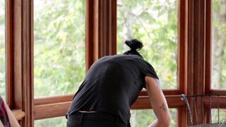 The pretty girl was fucked in the kitchen by a sexy Vietnamese with a strap-on
