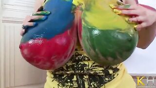 A woman with big tits creates a picture while masturbating her pussy