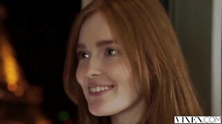 The guy carefully licks the red hair of his girlfriend in a passionate scene