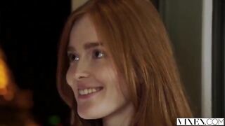 The guy carefully licks the red hair of his girlfriend in a passionate scene