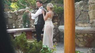 A blonde is having fun with her new husband on his honeymoon